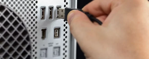 person-inserting-usb-cable-on-usb-port