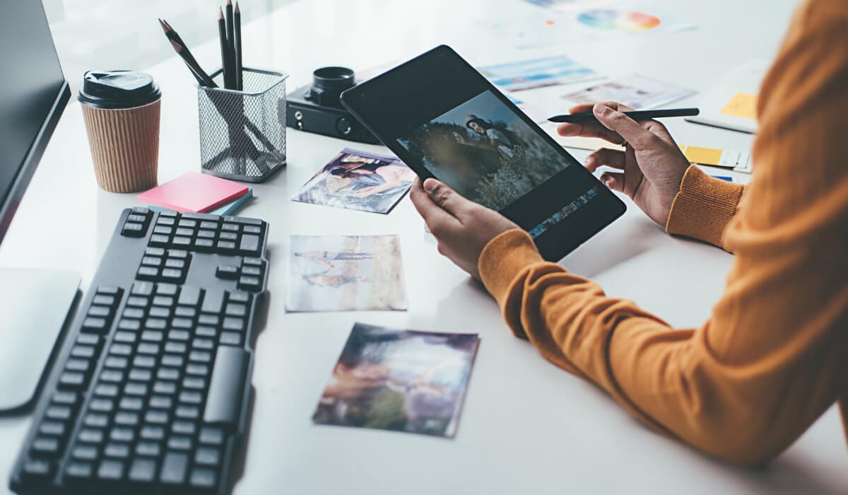 a person editing a photo on tablet